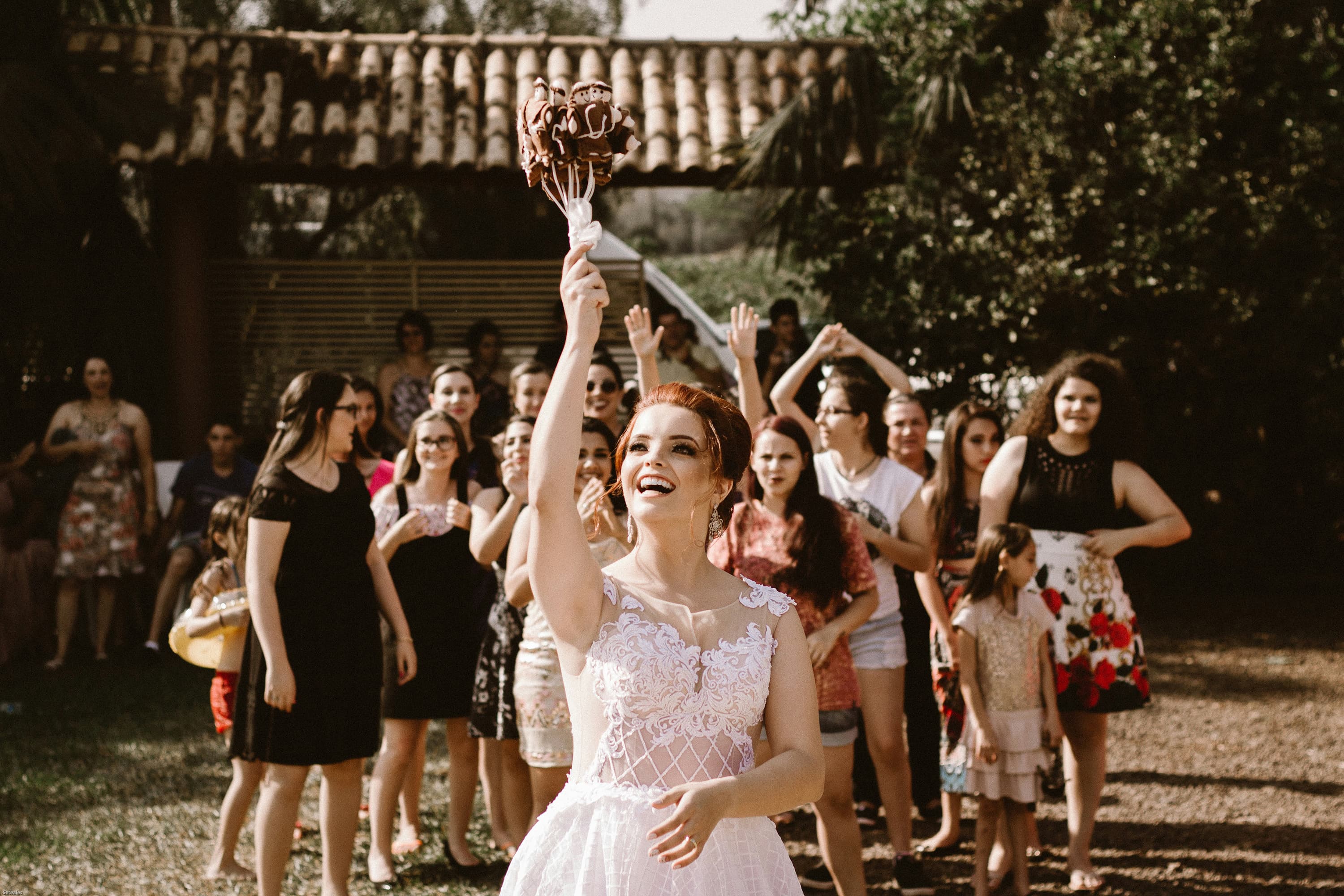 The bride throws the wedding bouquet.