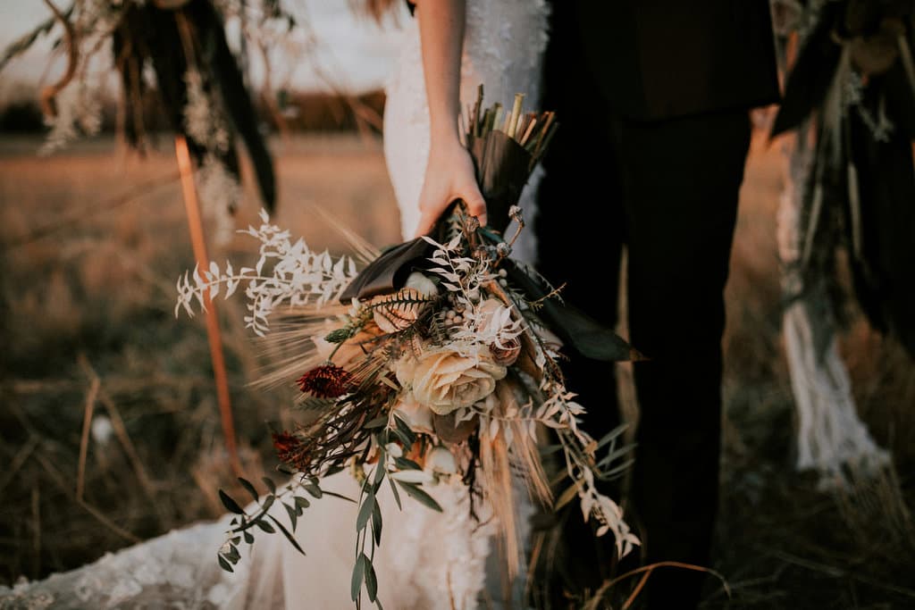 The bridal bouquet in the girl's hand.